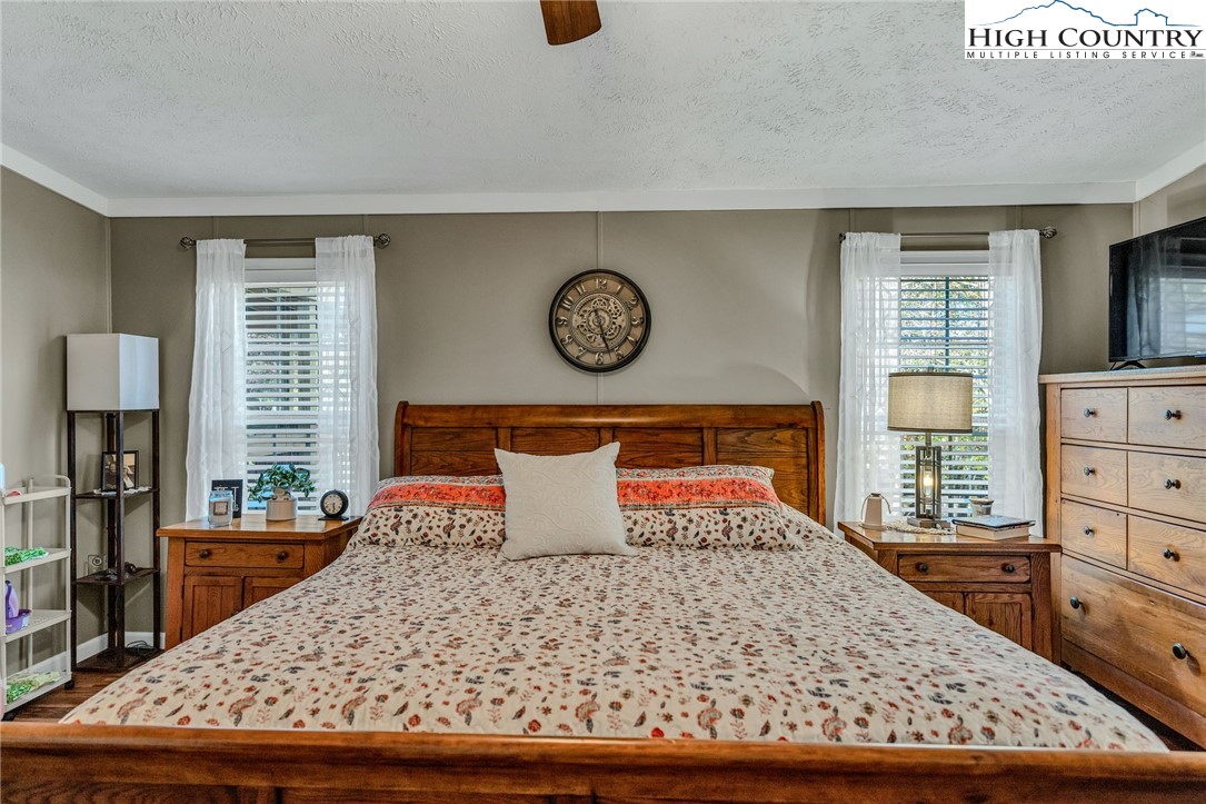 1108 Bald Knob Road Sparta, NC 28675 - Photo 17 of 43 a bedroom with a bed and dresser