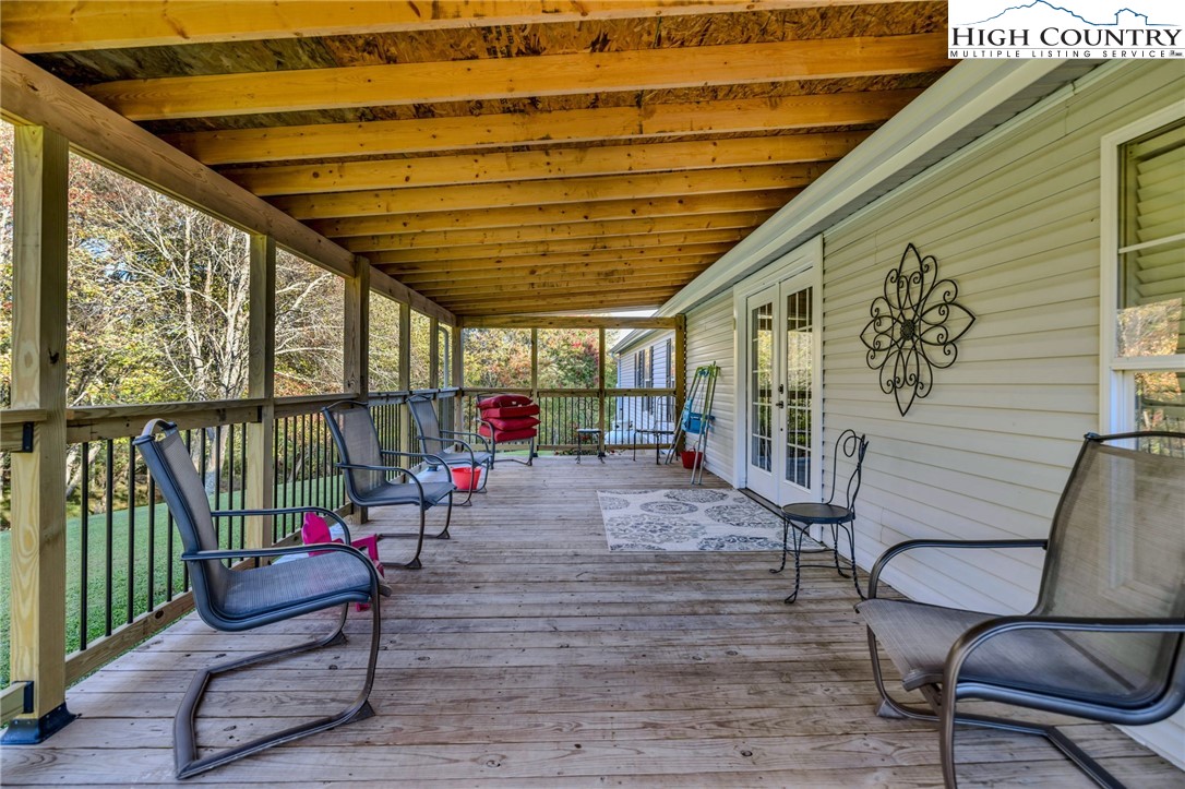 1108 Bald Knob Road Sparta, NC 28675 - Photo 6 of 43 a sitting area with furniture and wooden deck