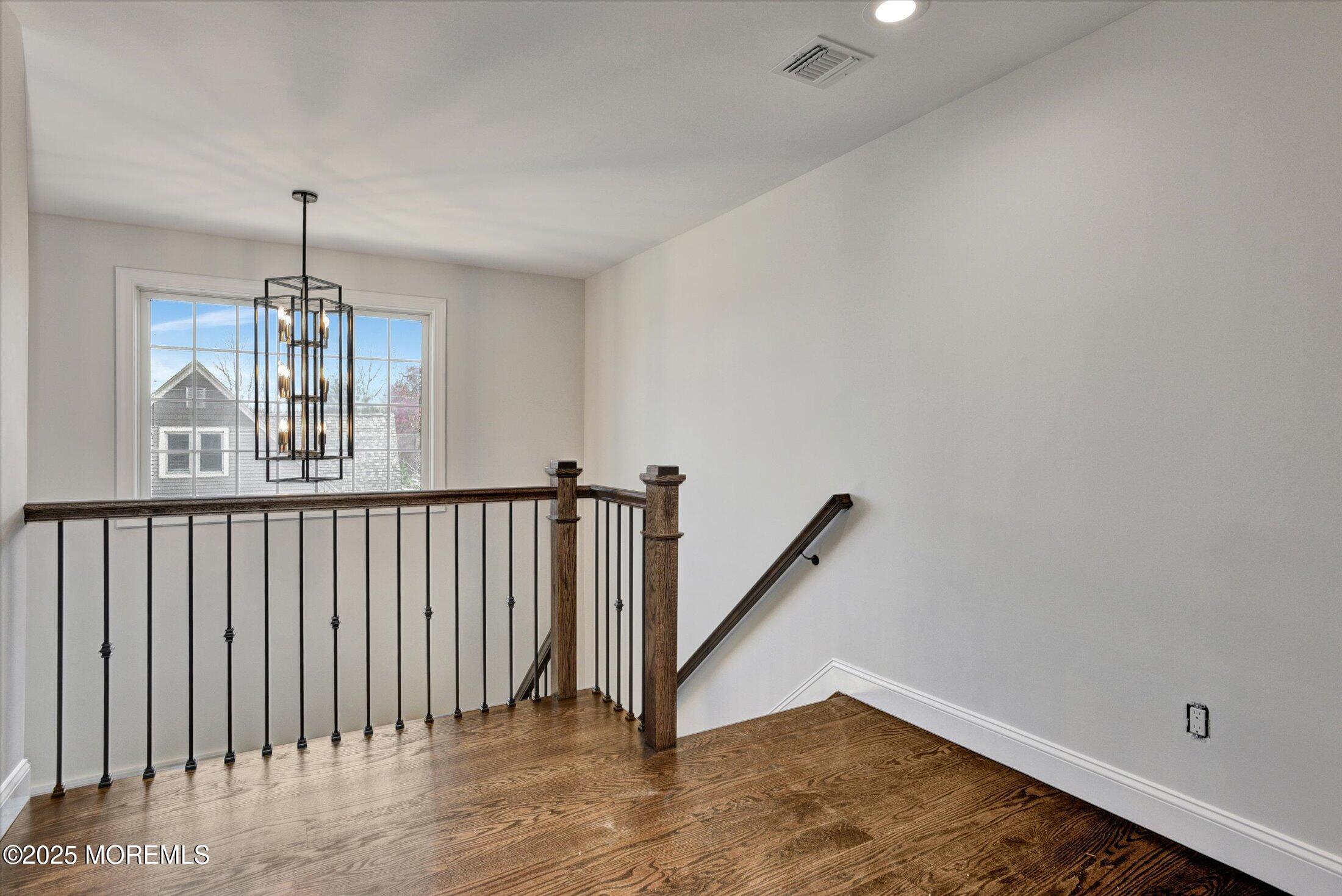 a view of a hallway with staircase