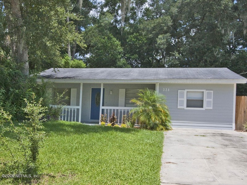 221 Swallow Road St. Augustine, FL 32086 - Photo 1 of 17 a front view of a house with garden