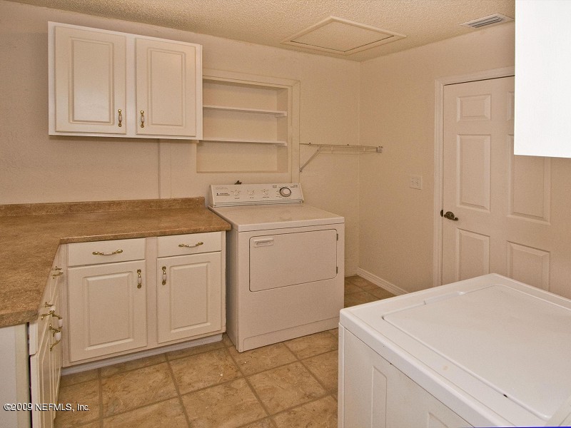 221 Swallow Road St. Augustine, FL 32086 - Photo 12 of 17 a utility room with sink dryer and washer