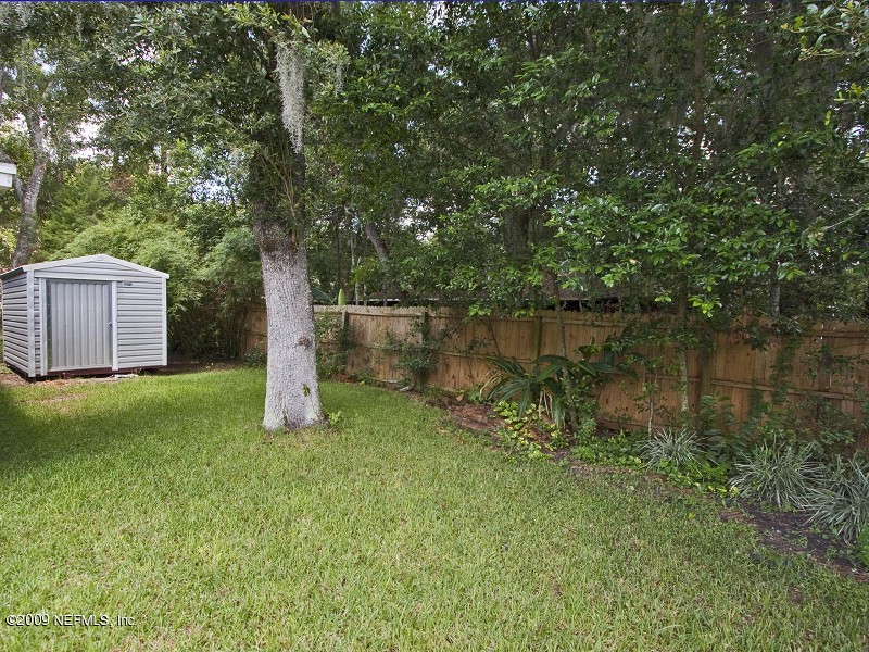 221 Swallow Road St. Augustine, FL 32086 - Photo 14 of 17 a view of a backyard with a tree