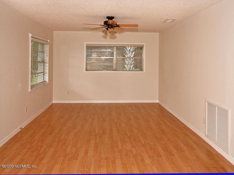 221 Swallow Road St. Augustine, FL 32086 - Photo 2 of 17 a view of an empty room with a window