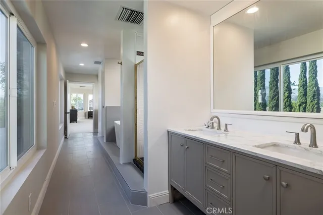 a bathroom with a sink and mirror