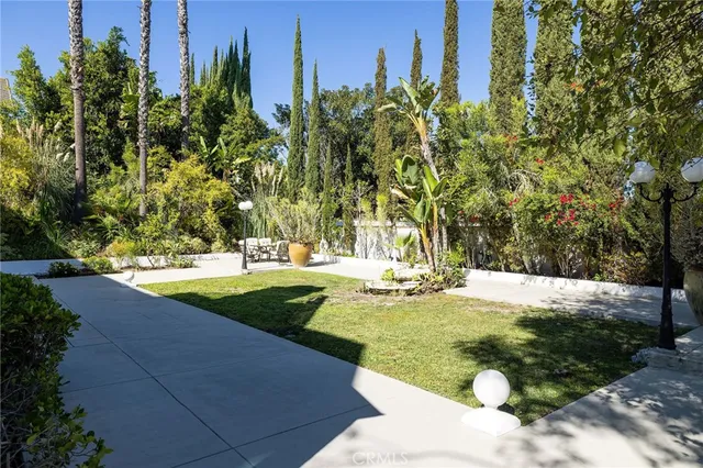 a view of a swimming pool with a yard