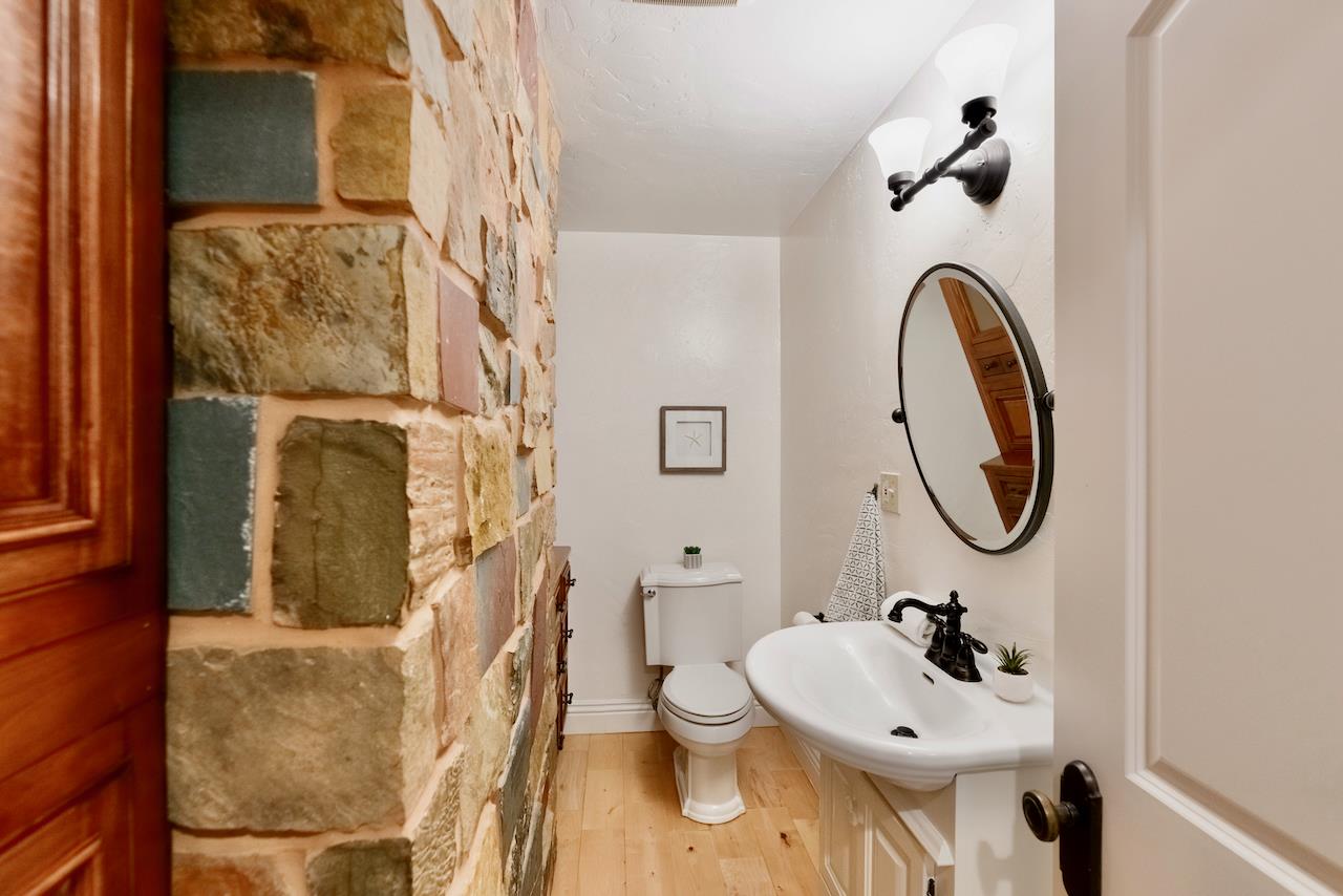 295 Jim's Road Ben Lomond, CA 95005 - Photo 73 of 139 a bathroom with a sink and mirror with toilet