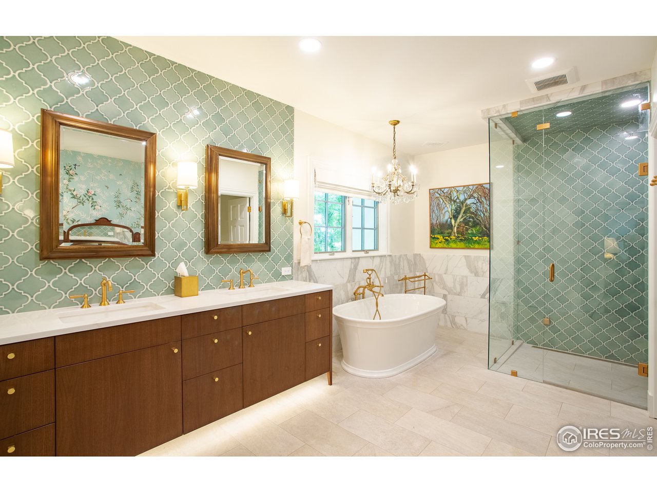 985 Gilbert Street Boulder, CO 80302 - Photo 24 of 40 a spacious bathroom with a double vanity sink toilet mirror and bathtub