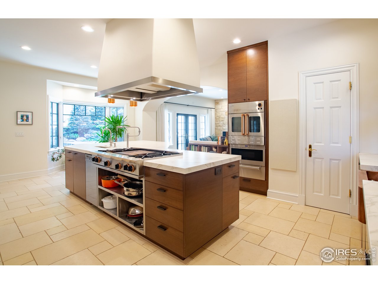 985 Gilbert Street Boulder, CO 80302 - Photo 6 of 40 a kitchen with stainless steel appliances granite countertop a stove a sink and a refrigerator