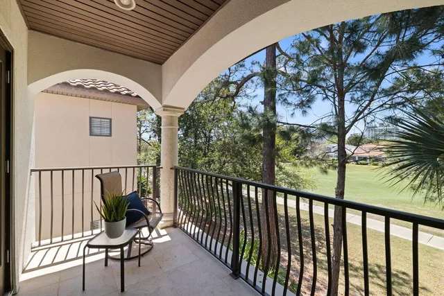 a view of a two chairs in the balcony