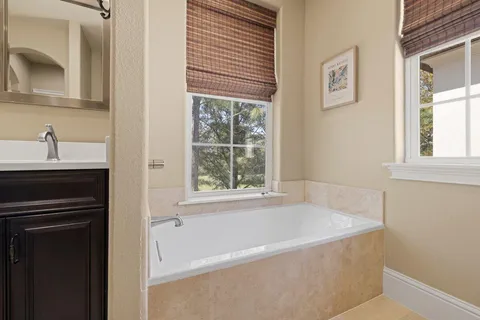 a bathroom with a bathtub and a sink