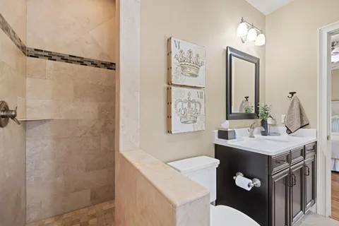 a bathroom with a sink vanity and a mirror