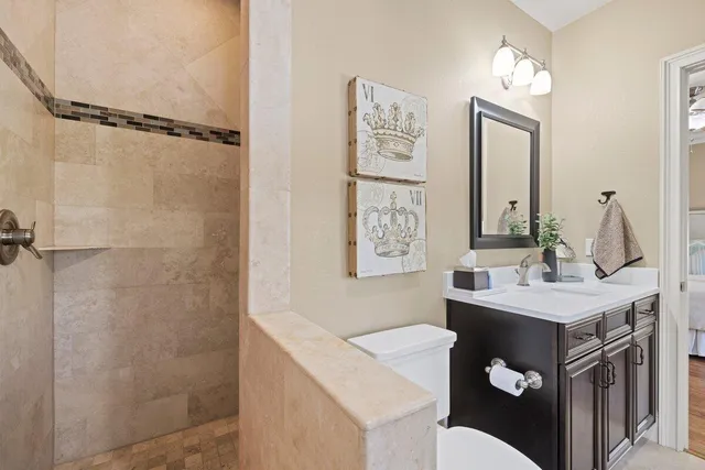 a bathroom with a sink vanity and a mirror