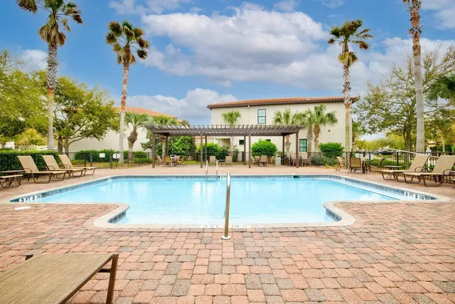 a view of a swimming pool and a porch