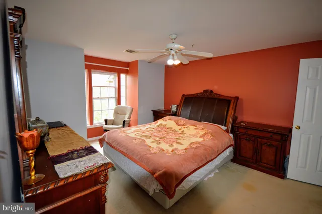 a bedroom with a bed and window