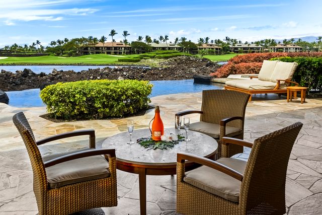 a view of a chairs and table in the terrace