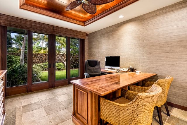 a view of a patio with a table and chairs
