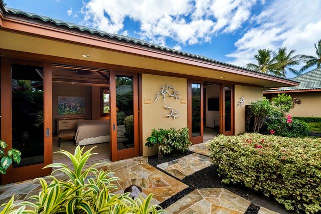 front view of the house with potted plants