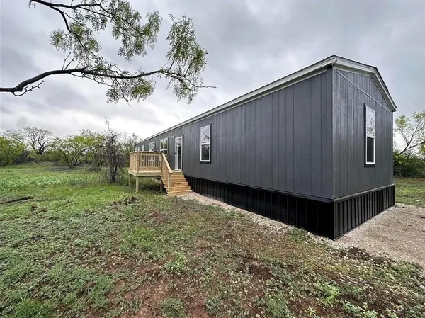 a house view with a backyard space