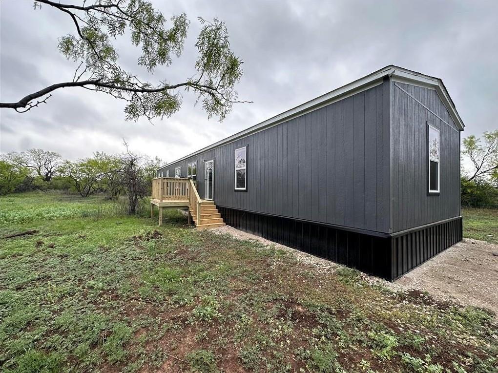 a house view with a backyard space