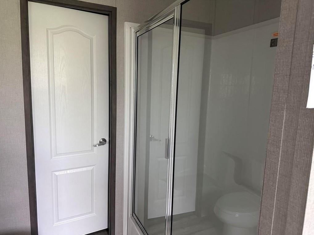 1848 South 4th Merkel, TX 79536 - Photo 3 of 8 a bathroom with a glass shower door
