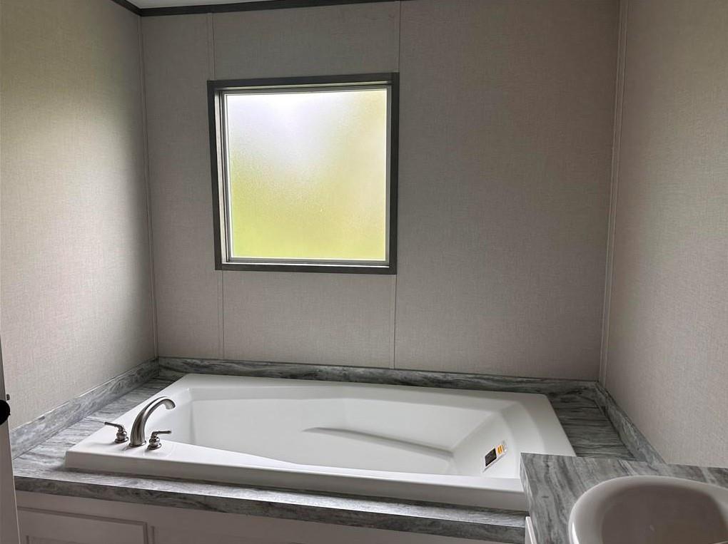 1848 South 4th Merkel, TX 79536 - Photo 4 of 8 a bathroom with a bathtub