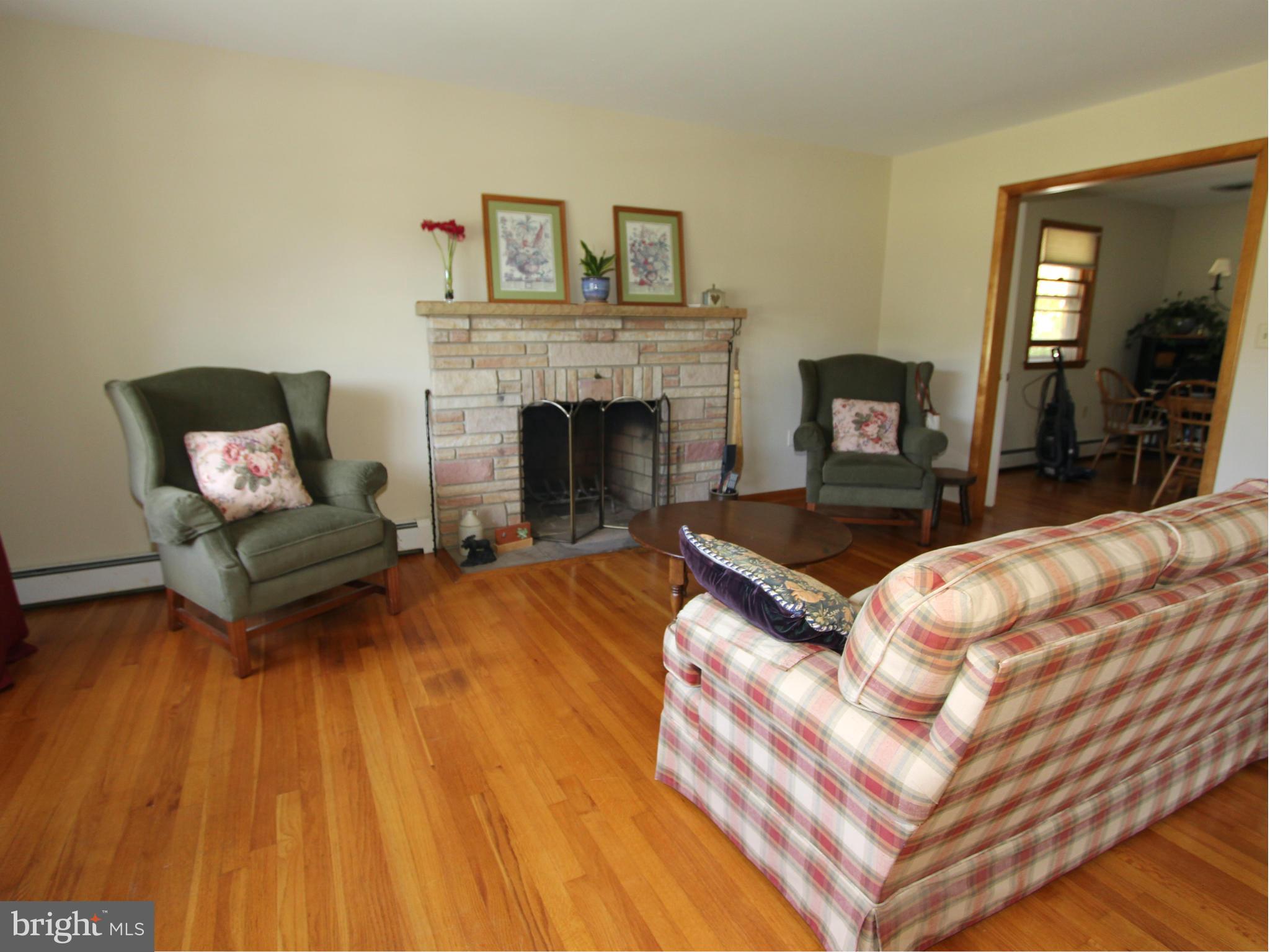 7633 Old Receiver Road Frederick, MD 21702 - Photo 3 of 27 Spacious Living Room with Stone Fireplace