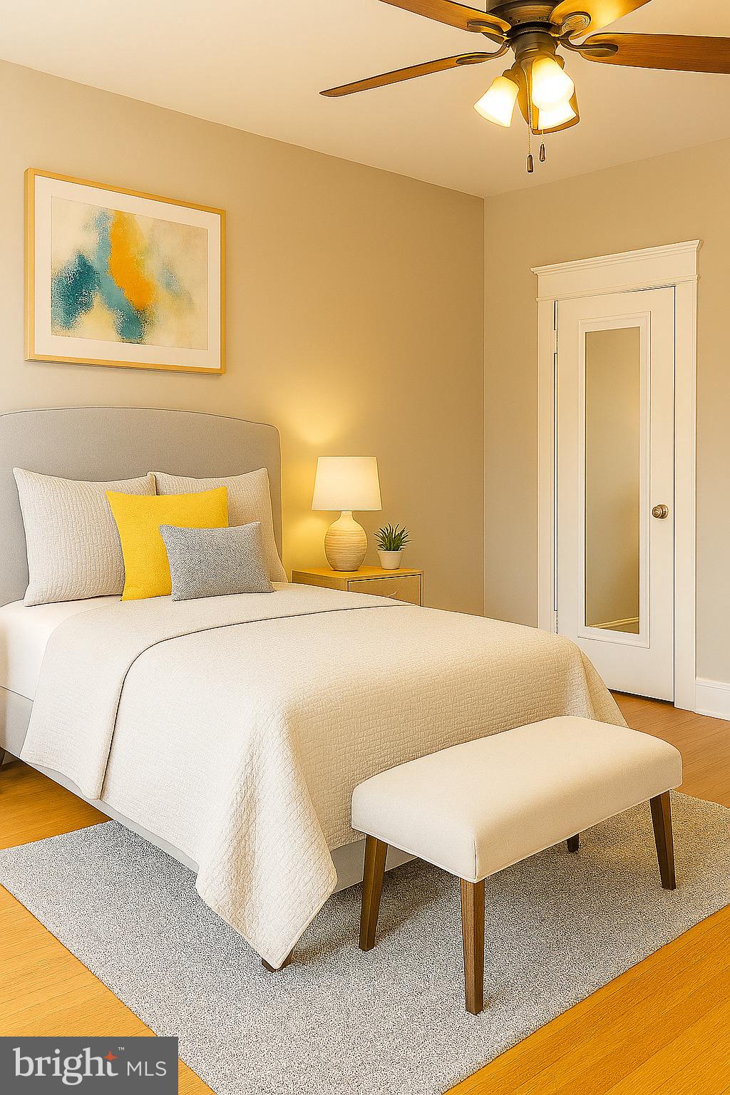 100 Morton Avenue, Unit D304 Ridley Park, PA 19078 - Photo 6 of 9 a bedroom with a bed and a chandelier