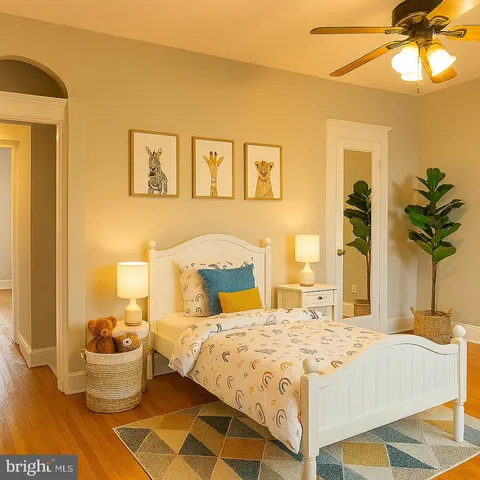 a bedroom with a bed and a potted plant