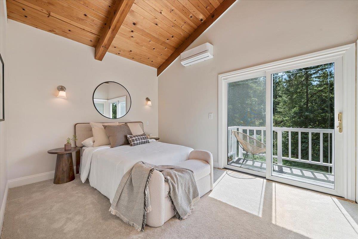 15251 Old Ranch Road Los Gatos, CA 95033 - Photo 25 of 38 a bed room with a bed and a large window