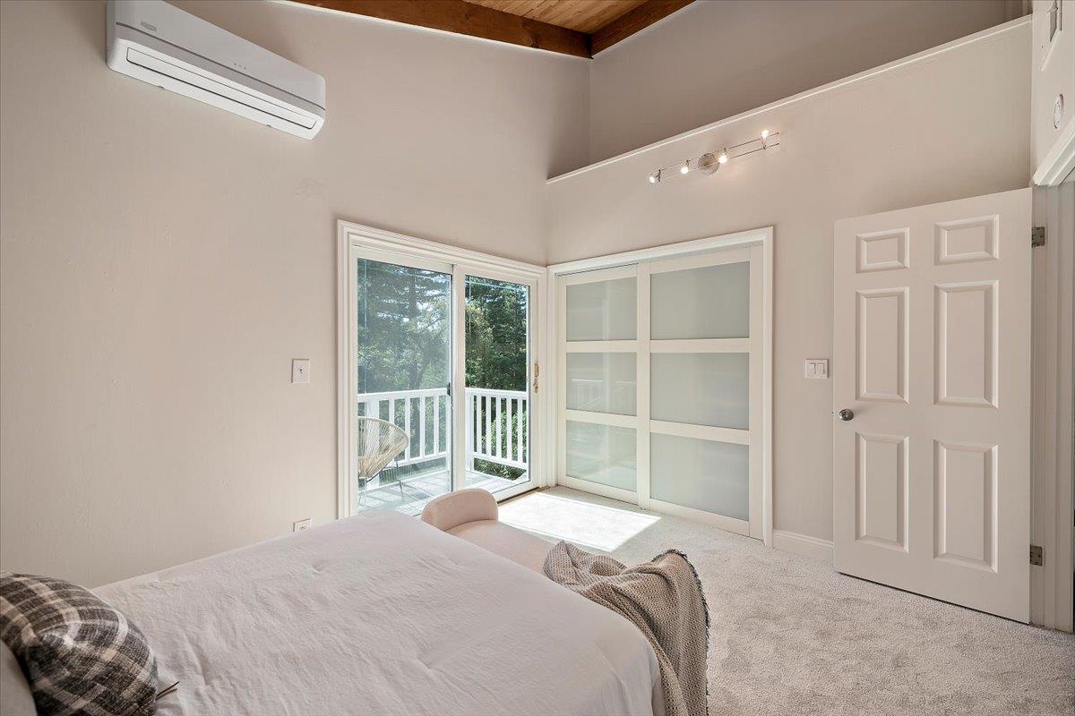 15251 Old Ranch Road Los Gatos, CA 95033 - Photo 26 of 38 a bed sitting in a bedroom next to a window