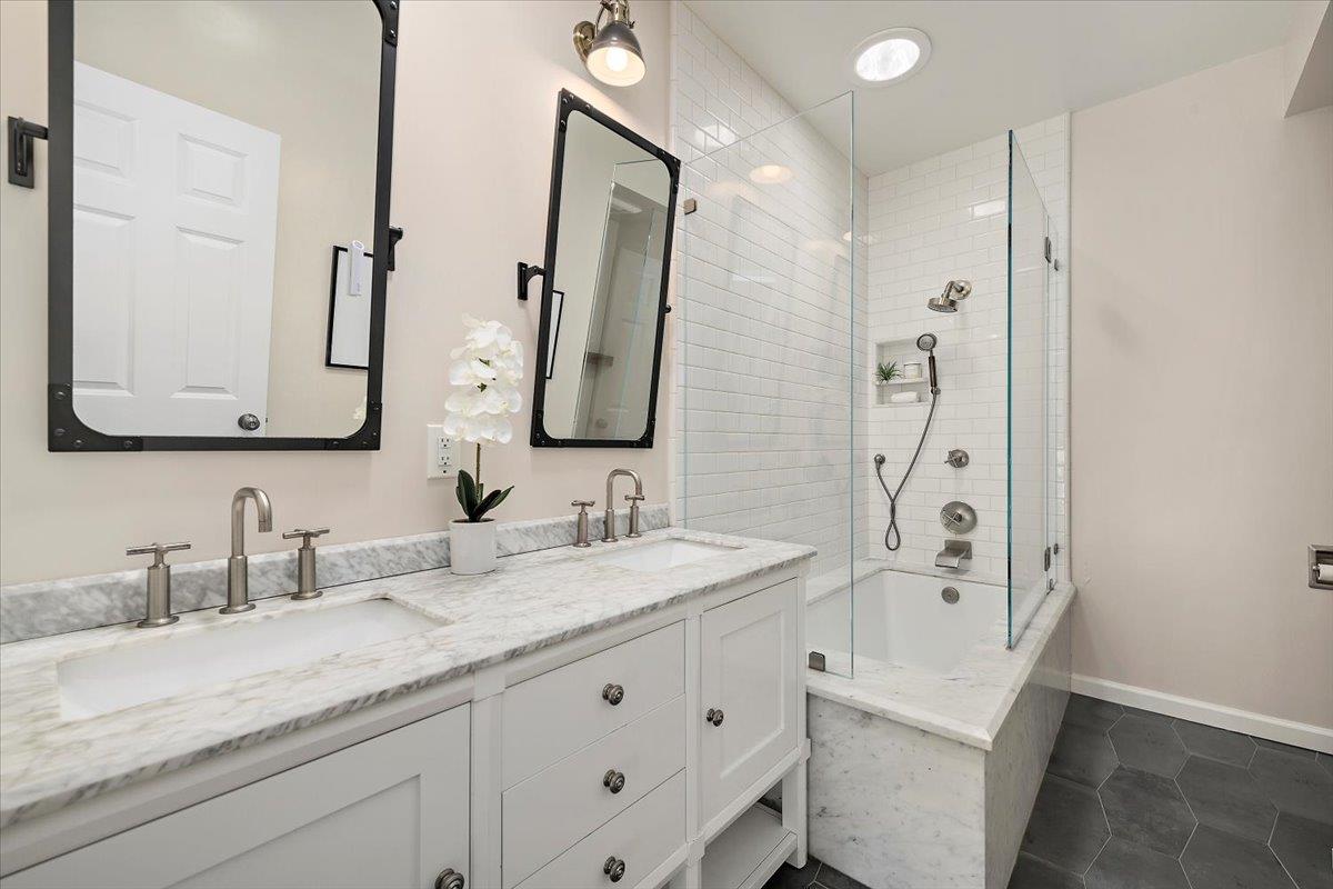 15251 Old Ranch Road Los Gatos, CA 95033 - Photo 27 of 38 a bathroom with a double vanity sink mirror double and a bathtub