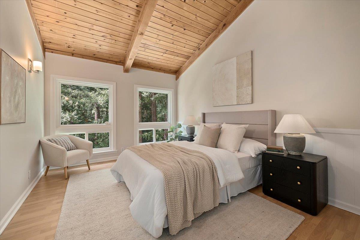 15251 Old Ranch Road Los Gatos, CA 95033 - Photo 28 of 38 a bedroom with a bed and wooden floor