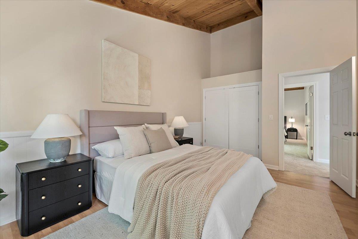 15251 Old Ranch Road Los Gatos, CA 95033 - Photo 29 of 38 a bedroom with a bed and a lamp