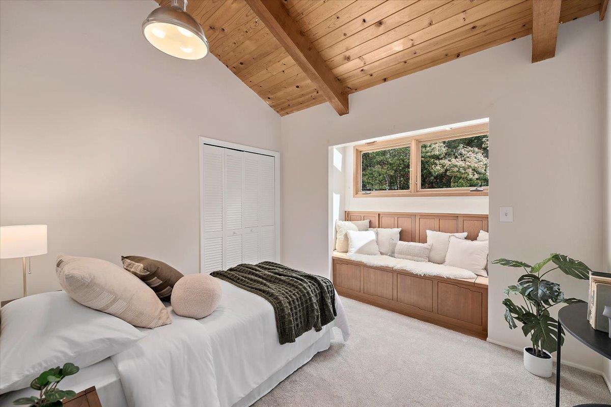 15251 Old Ranch Road Los Gatos, CA 95033 - Photo 30 of 38 a bedroom with a bed mirror and window