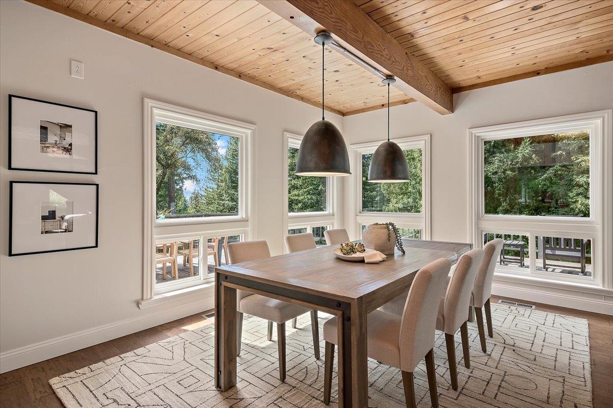 15251 Old Ranch Road Los Gatos, CA 95033 - Photo 6 of 38 a dining room with furniture a rug and wooden floor