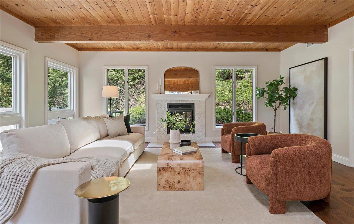 15251 Old Ranch Road Los Gatos, CA 95033 - Photo 7 of 38 a living room with furniture a fireplace and a large window
