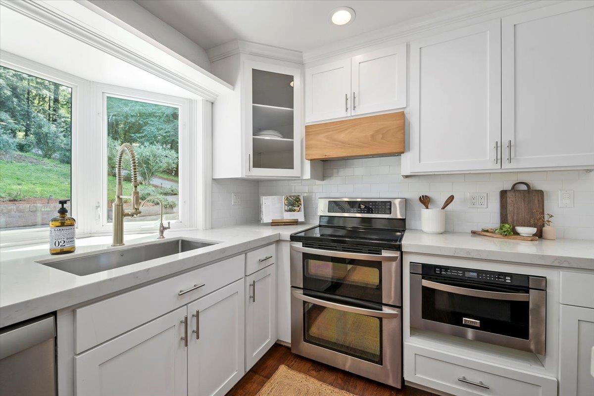 15251 Old Ranch Road Los Gatos, CA 95033 - Photo 10 of 38 a kitchen with a sink stove and cabinets