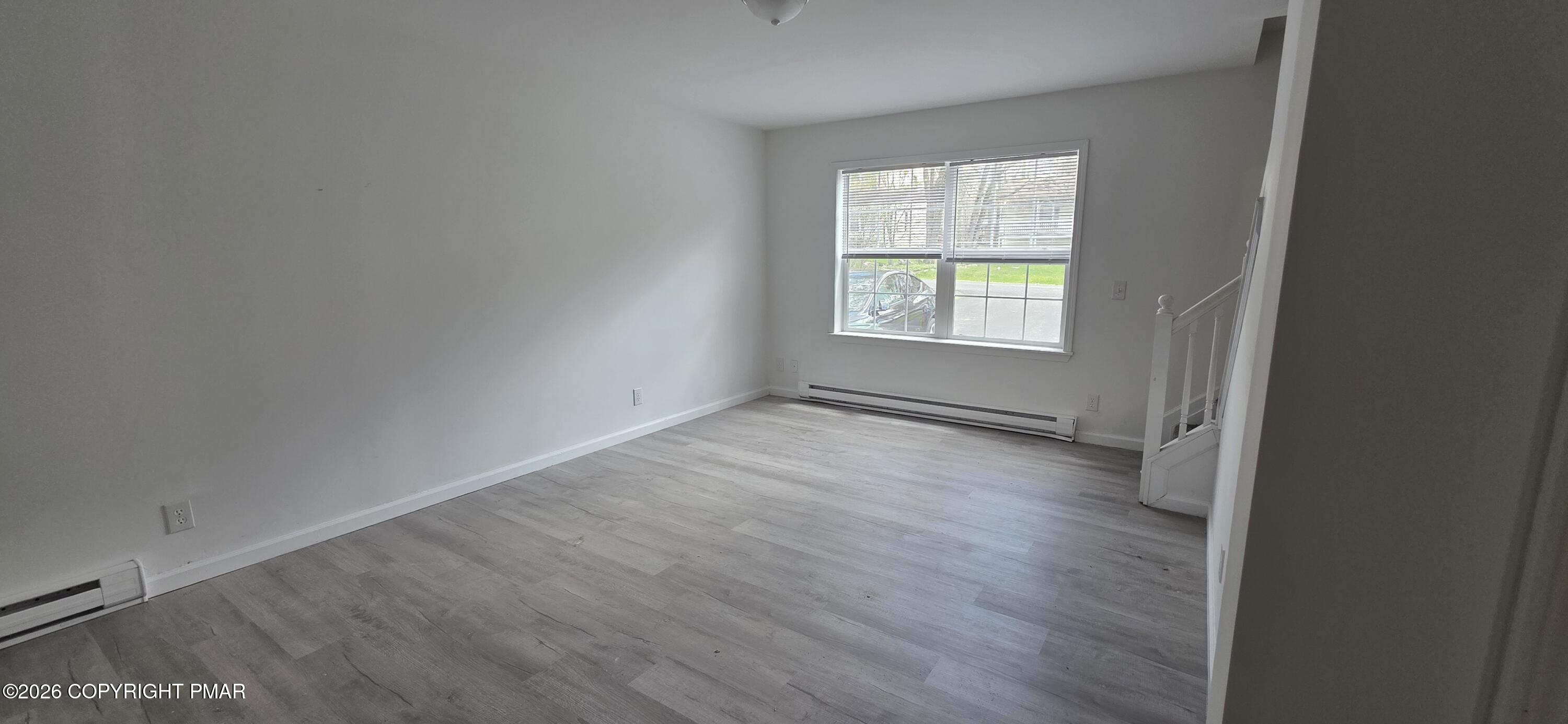 4715 Norwood Lane Tobyhanna, PA 18466 - Photo 3 of 14 an empty room with wooden floor and windows