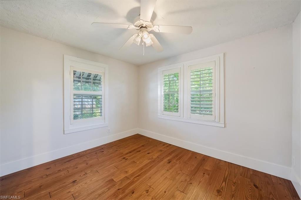 1984 Frederick Street Naples, FL 34112 - Photo 17 of 25 an empty room with a window and a ceiling fan