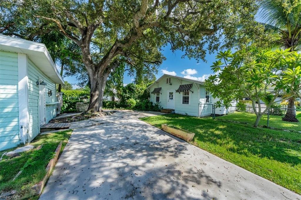 1984 Frederick Street Naples, FL 34112 - Photo 20 of 25 a view of a house with a yard