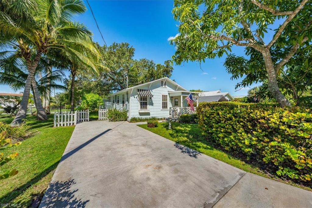 1984 Frederick Street Naples, FL 34112 - Photo 2 of 25 a house view with a garden space