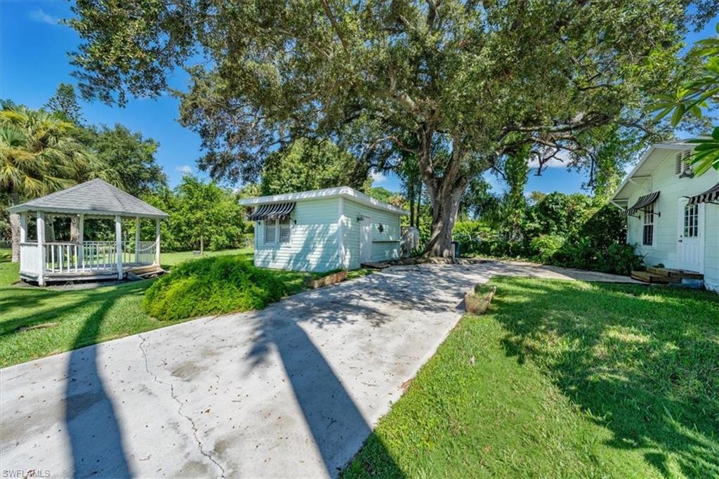 1984 Frederick Street Naples, FL 34112 - Photo 21 of 25 a front view of a house with a yard