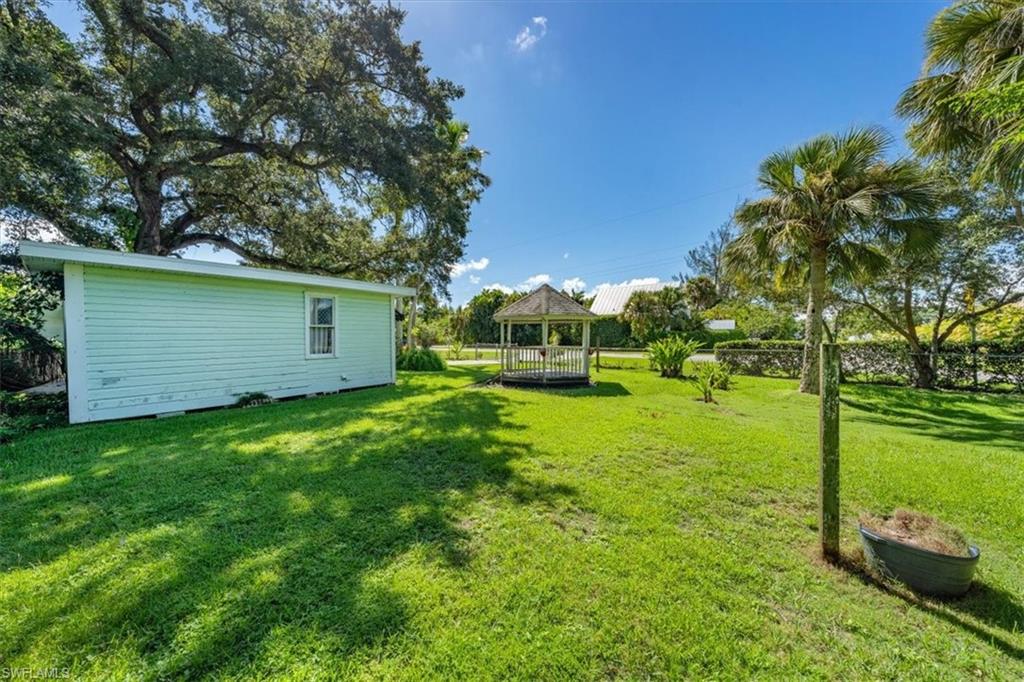 1984 Frederick Street Naples, FL 34112 - Photo 22 of 25 a view of a backyard with a garden