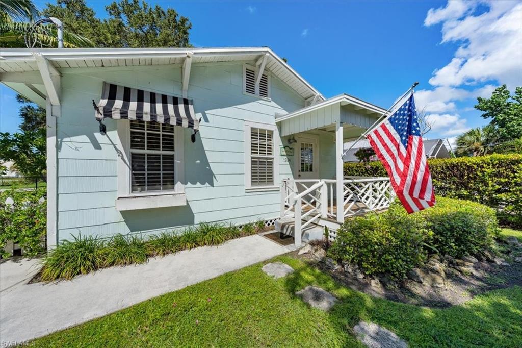 1984 Frederick Street Naples, FL 34112 - Photo 3 of 25 a front view of a house with garden