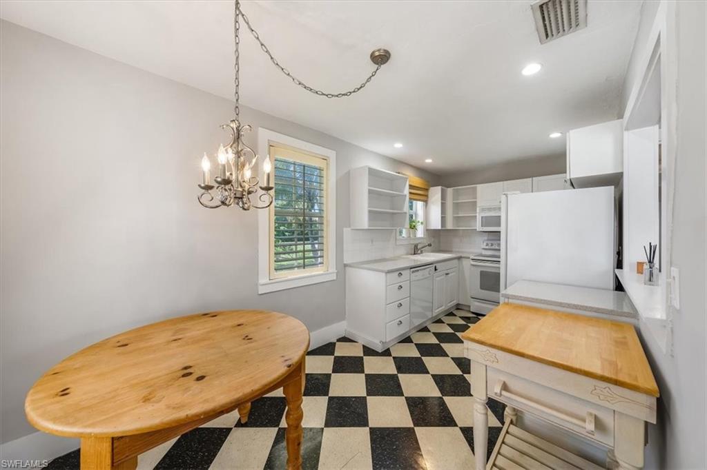 1984 Frederick Street Naples, FL 34112 - Photo 10 of 25 a bathroom with a sink a toilet a mirror and shower
