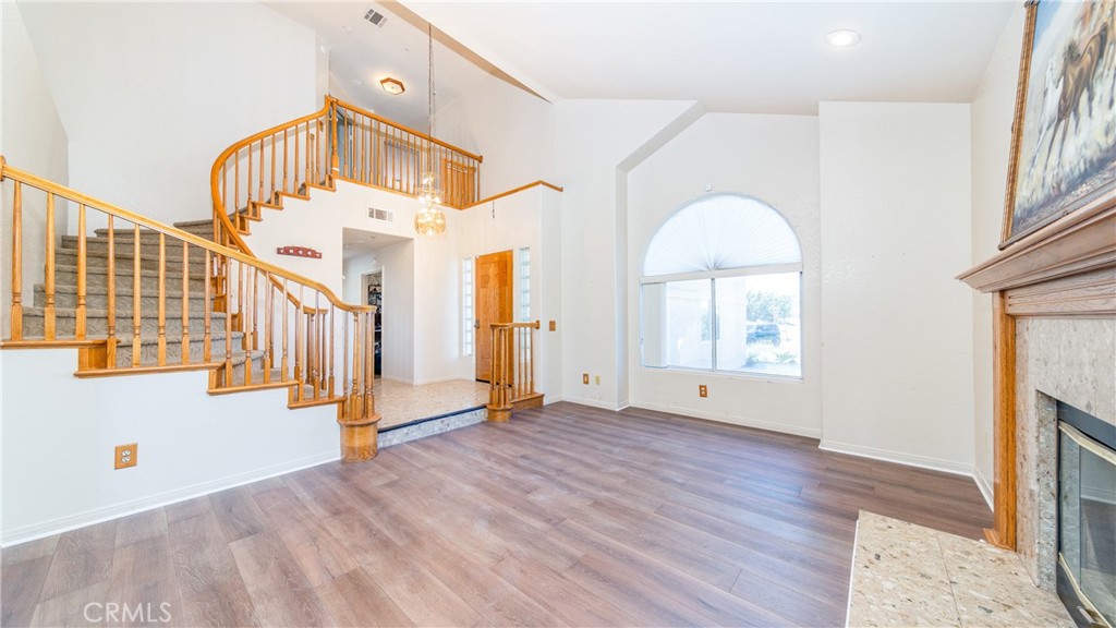 a view of an entryway with wooden floor
