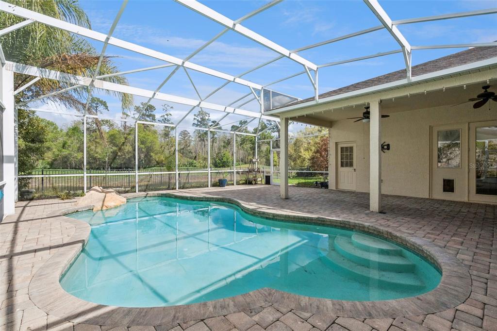 2541 Teton Stone Run Orlando, FL 32828 - Photo 3 of 82 a view of a house with backyard and sitting area