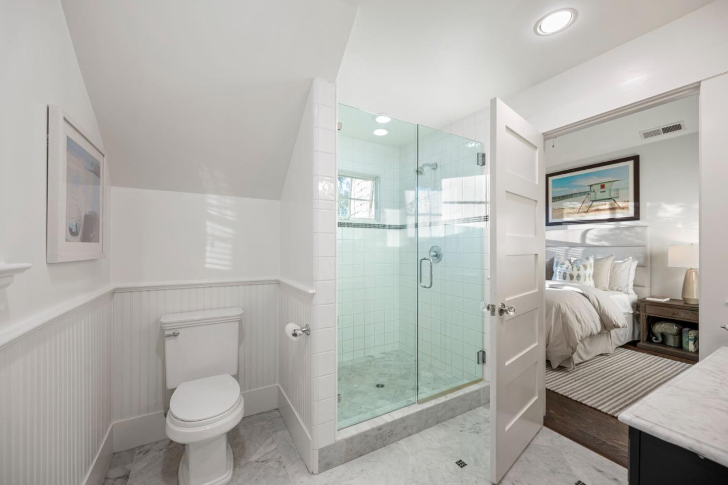 445 Arlington Road Redwood City, CA 94062 - Photo 24 of 50 a bathroom with a granite countertop shower a toilet and a sink