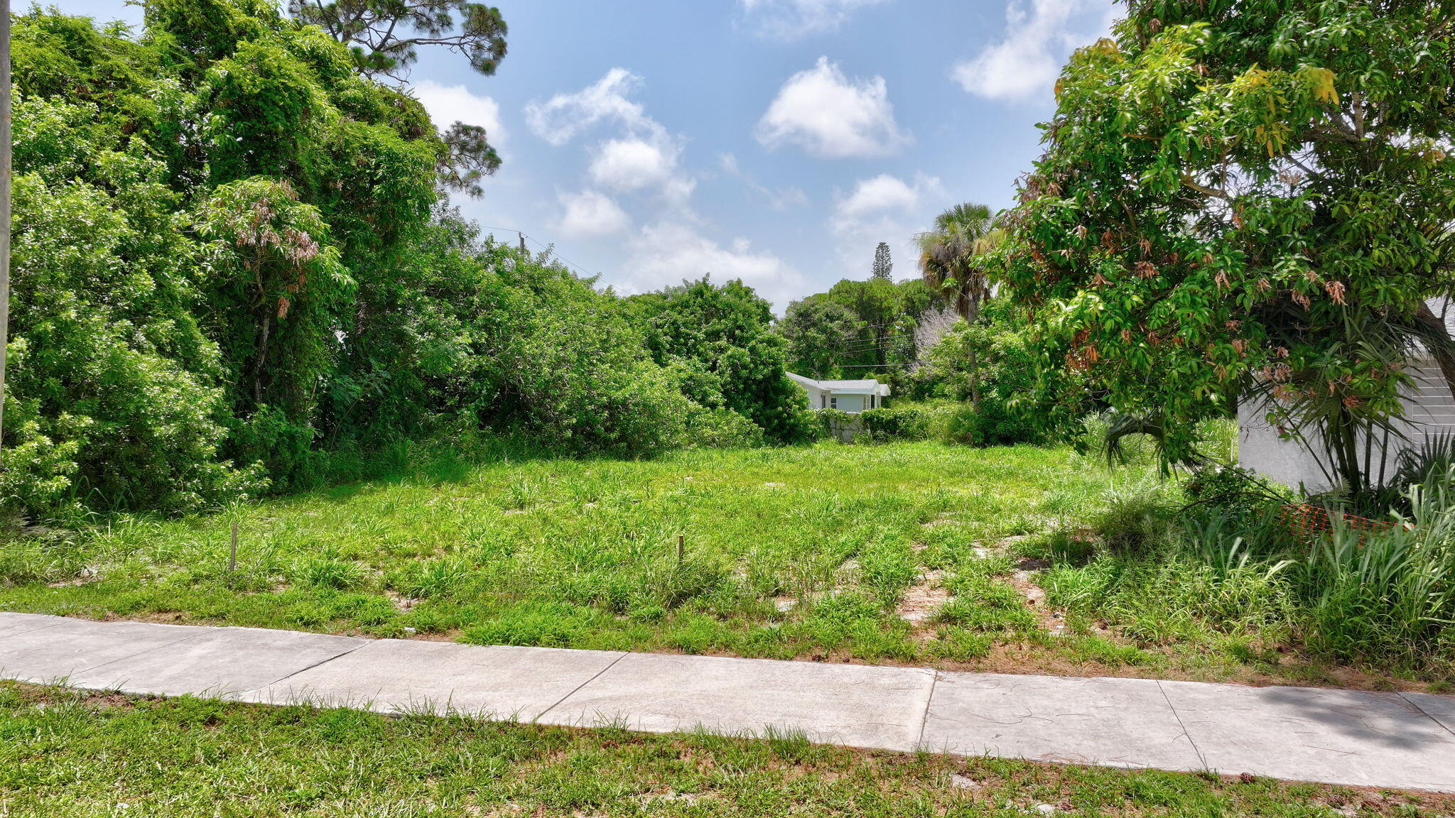 5684 Southeast 45th Avenue Stuart, FL 34997 - Photo 3 of 27 3-web-or-mls-DJI_20260620045737_0001_D_2