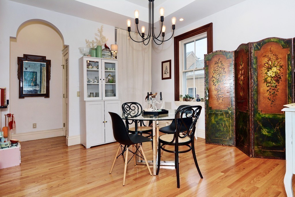 7 Winter Street, Unit 5 Salem, MA 01970 - Photo 14 of 41 a dining room with furniture a chandelier and wooden floor